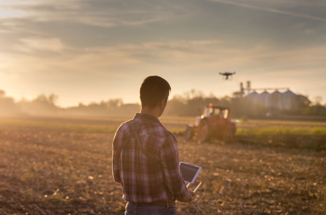 Farmer using drone to monitor crops. iStock.com/Jevtic
