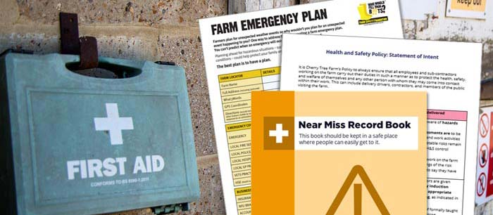 A first aid box next to farm safety information